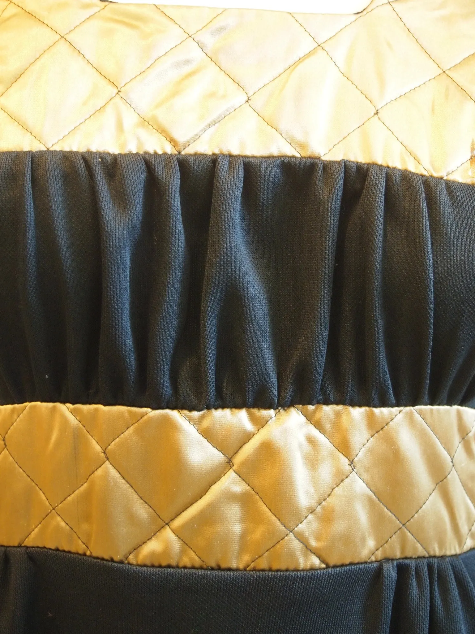 Black dress lily sleeves gold quilted collar and waist