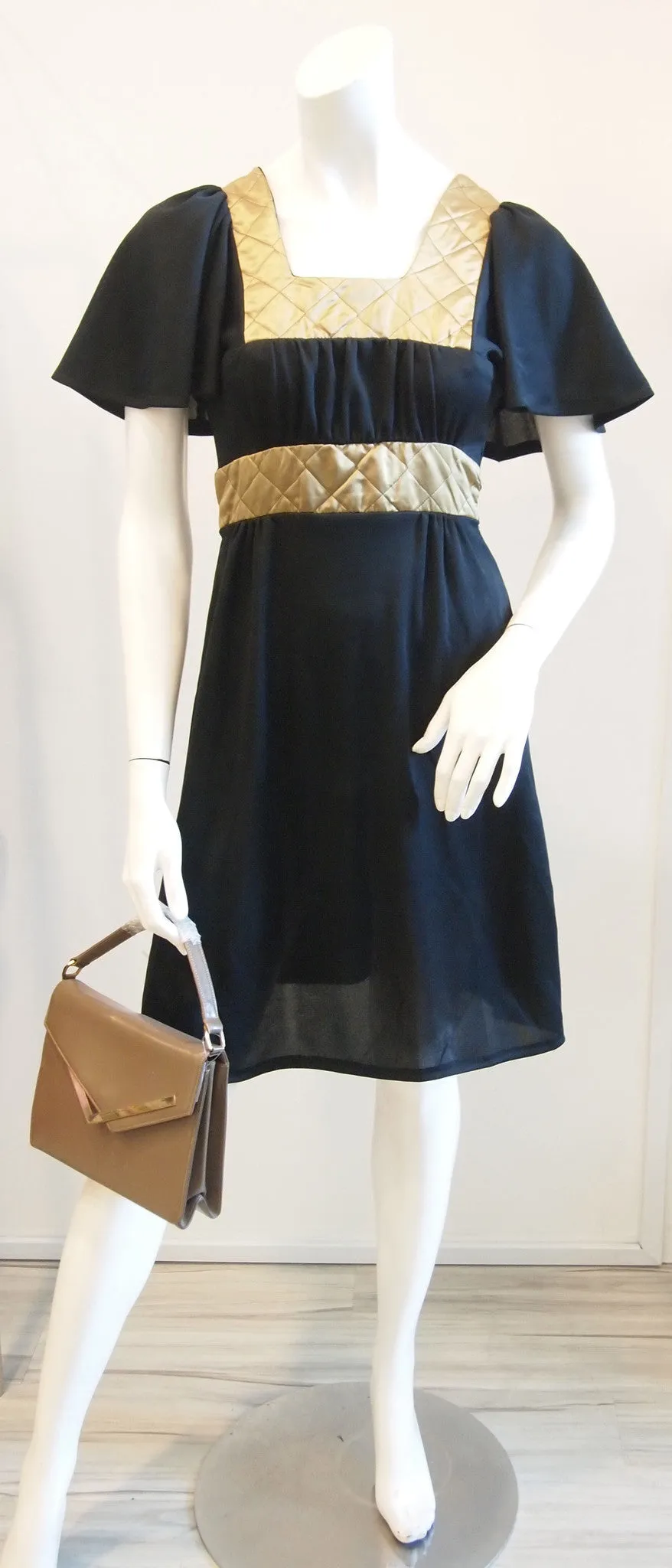 Black dress lily sleeves gold quilted collar and waist