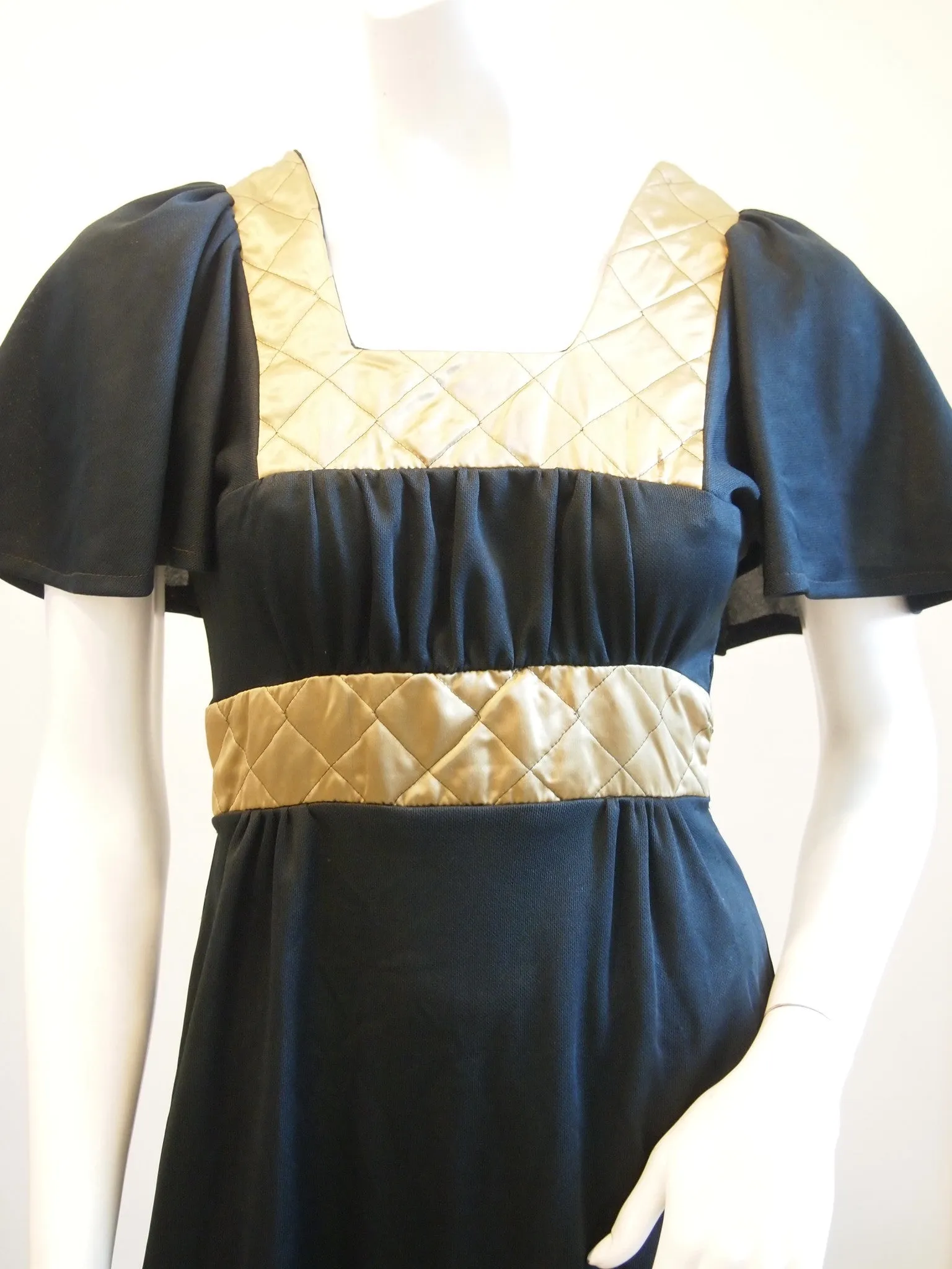 Black dress lily sleeves gold quilted collar and waist
